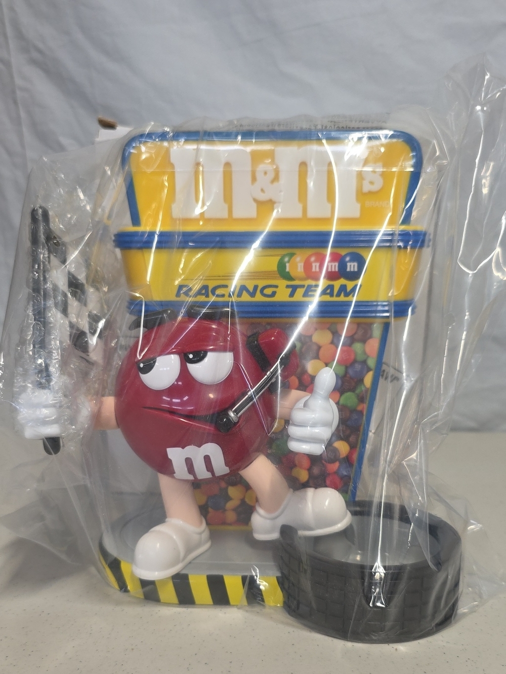 Vintage M&M's Racing Team candy dispenser featuring the red M&M character In Box